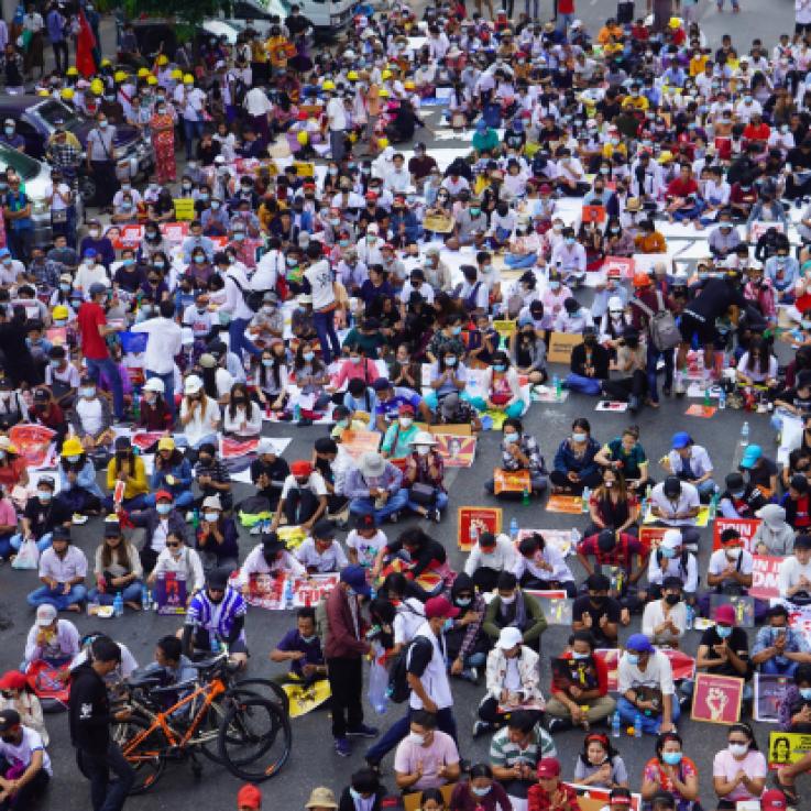 A mass protest in Myanmar. The photo shows hundreds of people in a street, from above